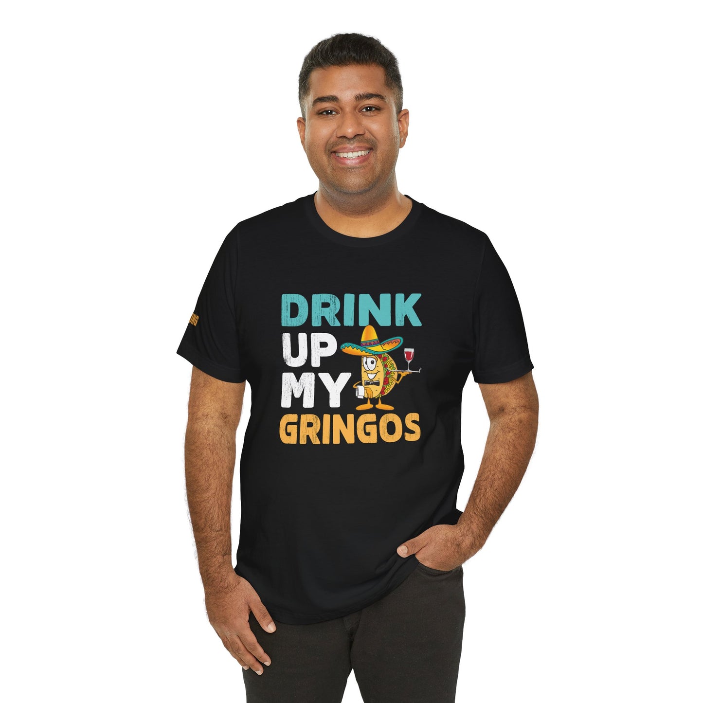 Model wearing Drink Up My Gringos t-shirt, available in multiple colors and plus sizes.