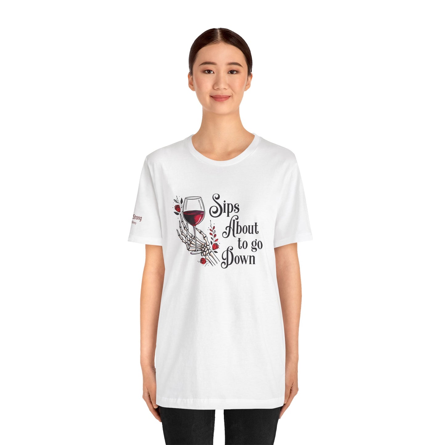 A skeleton hand holding a glass of red wine, surrounded by red roses and gothic floral accents, with the text "Sips About to Go Down" in an elegant but eerie font.