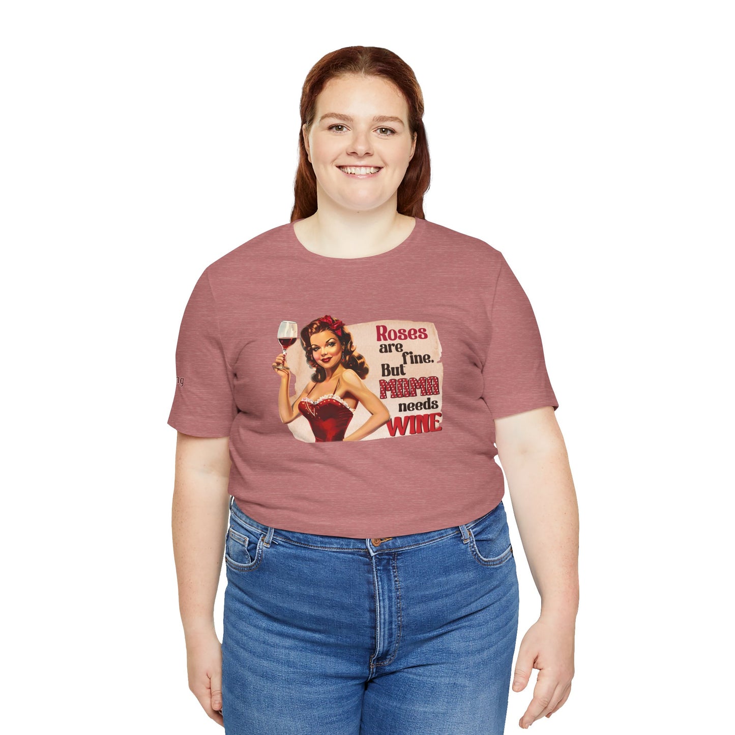 Vintage pin-up woman in a red dress, holding a glass of wine with a confident smile. The text reads: "Roses Are Fine, But Mama Needs Wine." - available in plus sizes.
