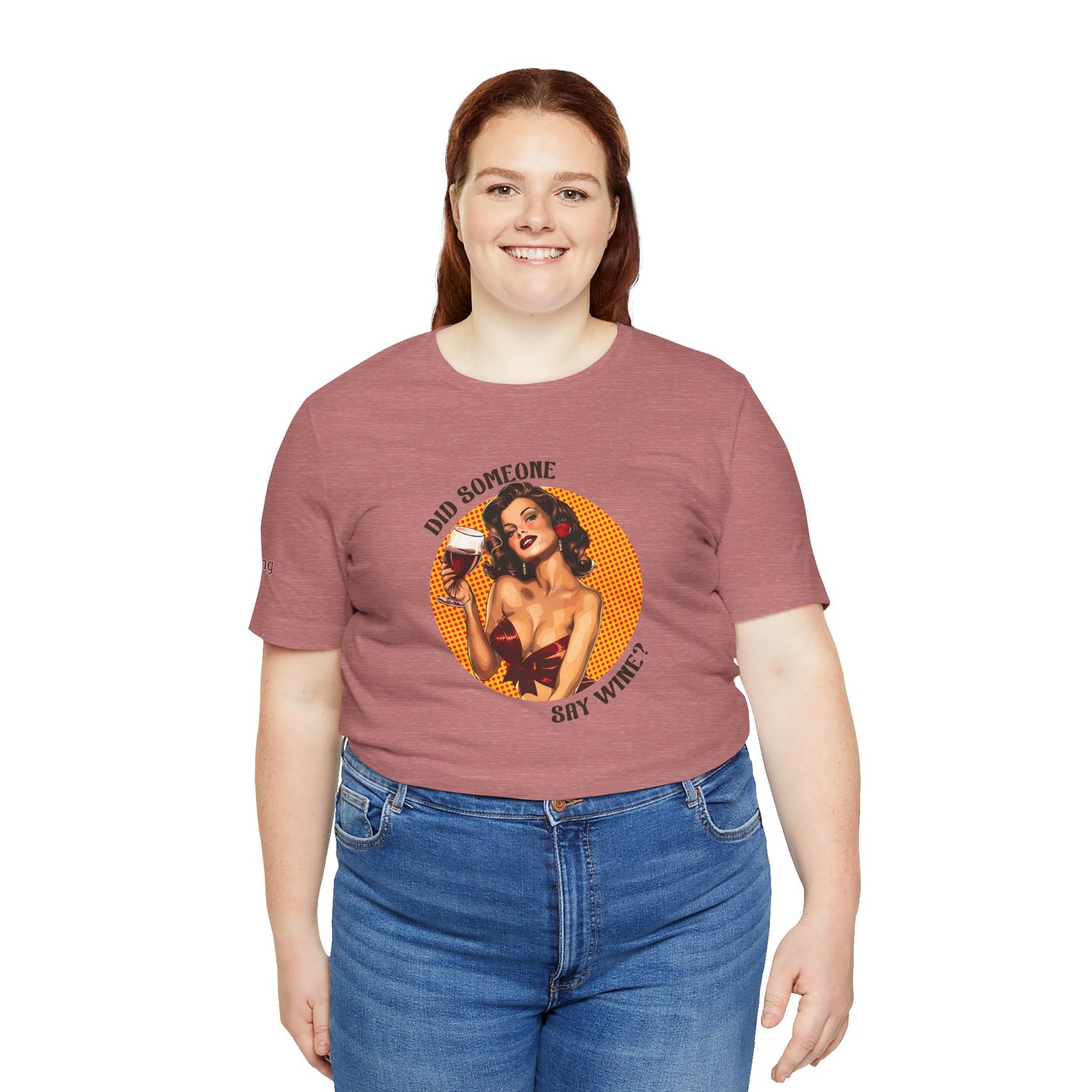 Brunette pin-up woman in a red ribbon top holding a glass of red wine. The text reads: "Did Someone Say Wine?" in bold, curved lettering. Available in plus sizes.