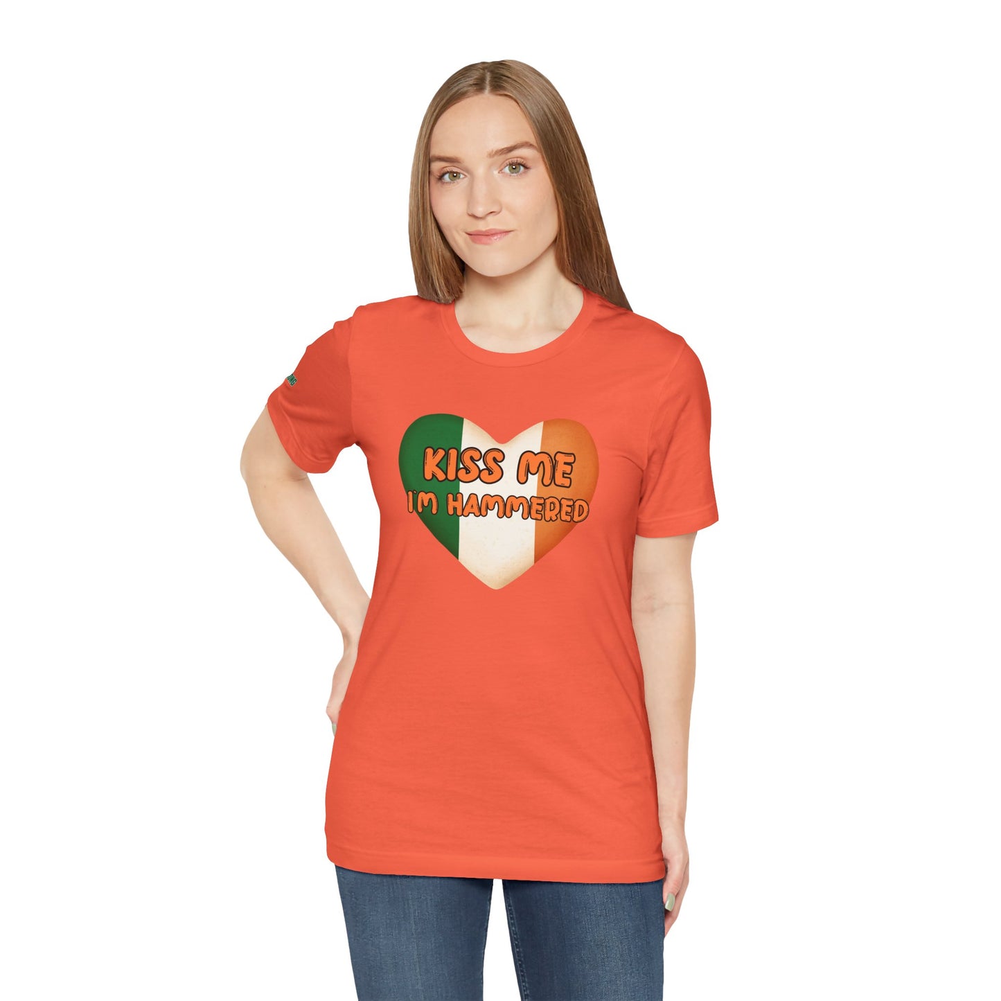 Funny St. Patrick’s Day t-shirt featuring a heart-shaped Irish flag with the phrase “Kiss Me, I’m Hammered” in bold, playful font.