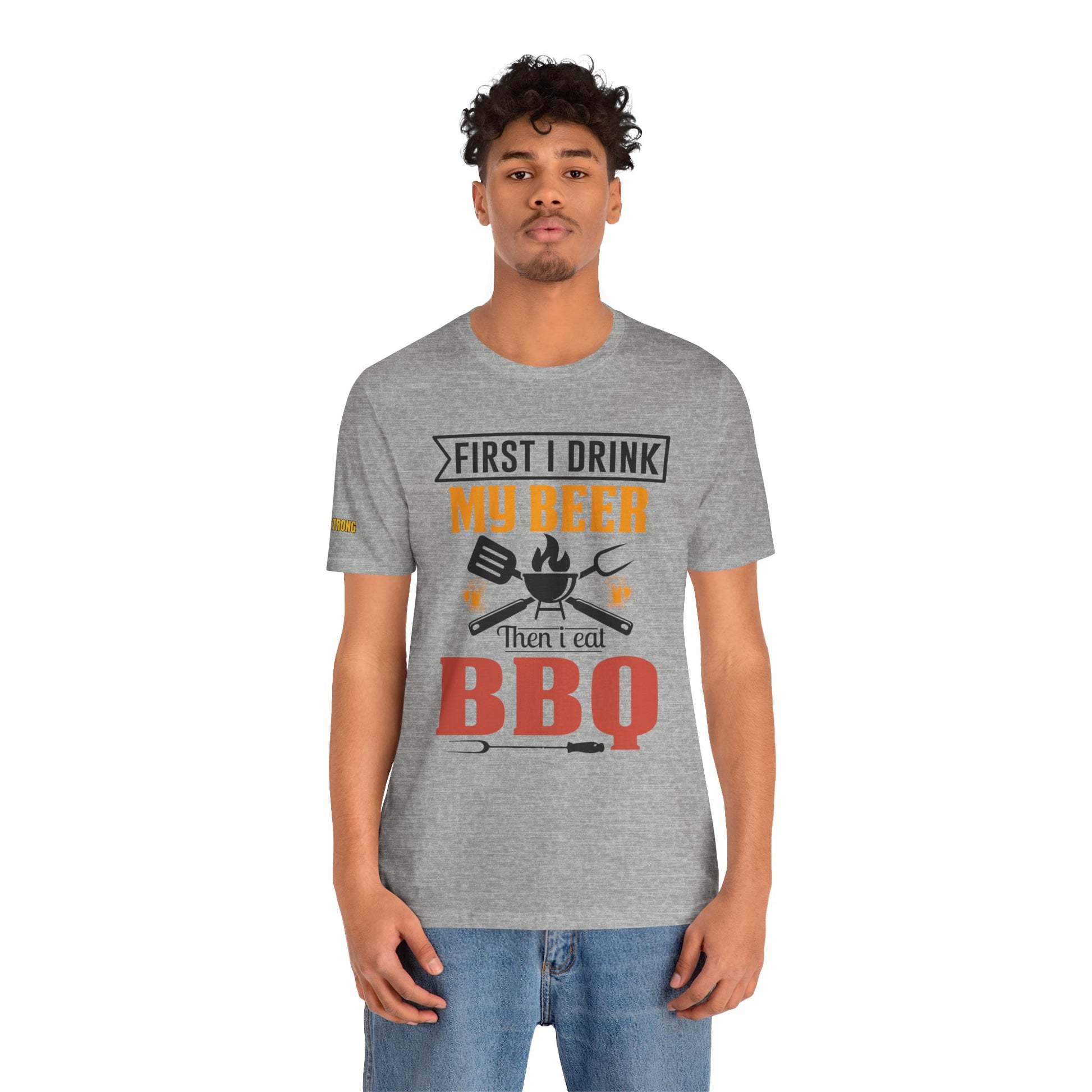 BBQ and beer t-shirt with "First I Drink My Beer, Then I Eat BBQ" text, featuring beer mugs and bold lettering.