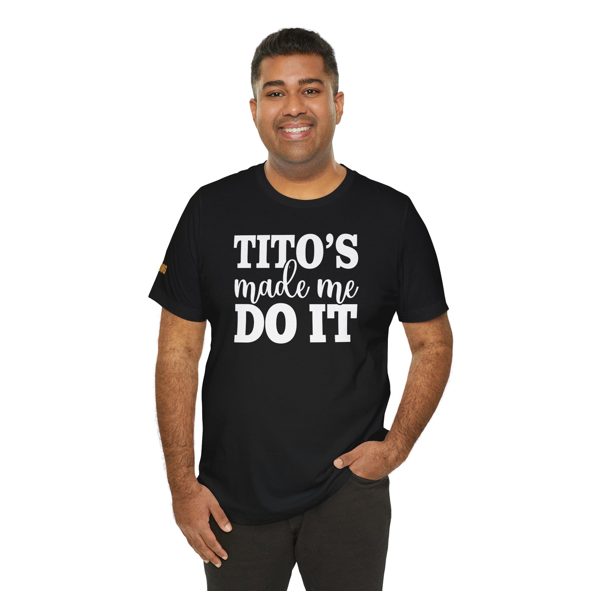 Model wearing the "Tito’s Made Me Do It" t-shirt, available in multiple colors and plus sizes, making it the perfect fit for vodka lovers everywhere.