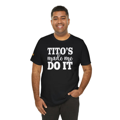 Model wearing the "Tito’s Made Me Do It" t-shirt, available in multiple colors and plus sizes, making it the perfect fit for vodka lovers everywhere.