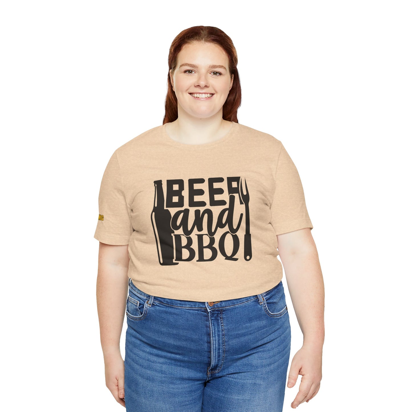 Beer and BBQ t-shirt featuring a bold design with a beer bottle, grilling fork, and fun typography. Available in plus sizes.