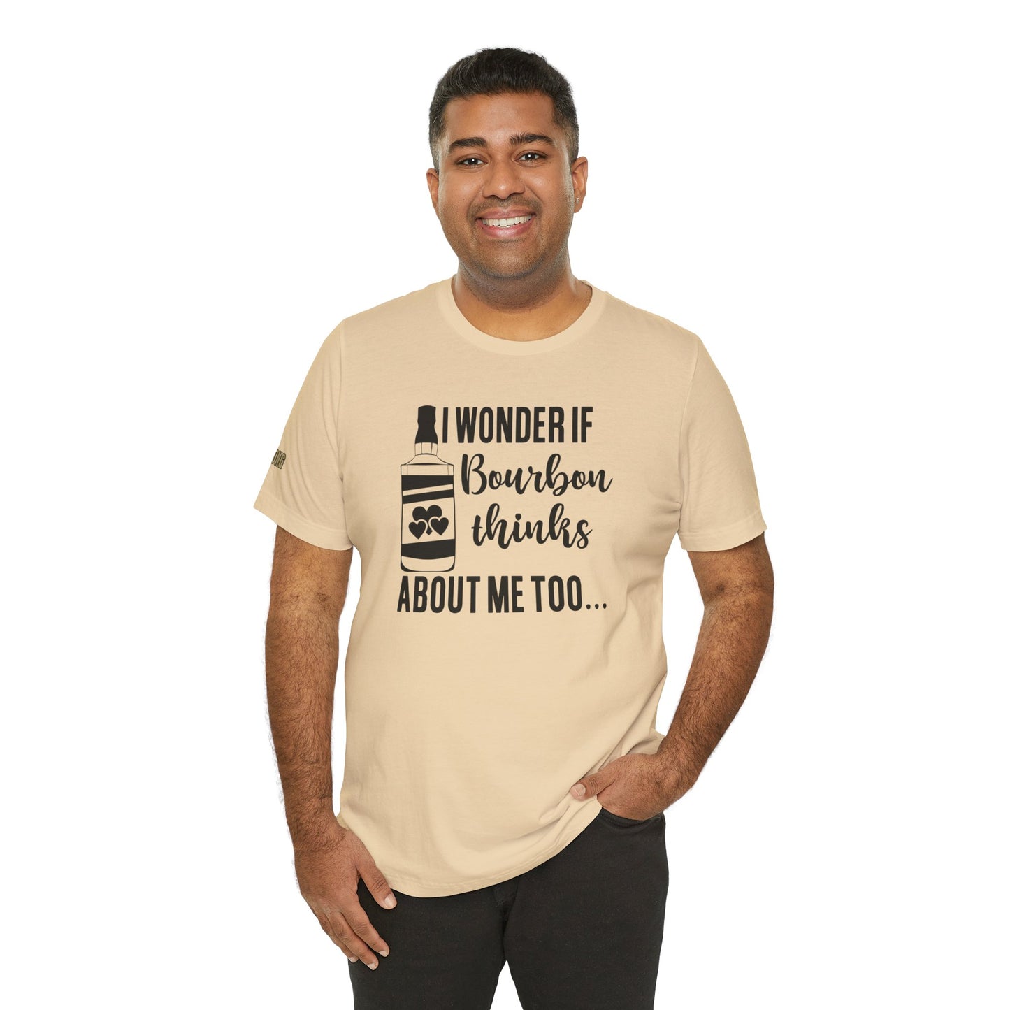 I Wonder If Bourbon Thinks About Me Too humorous bourbon lover graphic tee with bottle and hearts design in shade of beige - available in many colors and plus sizes.