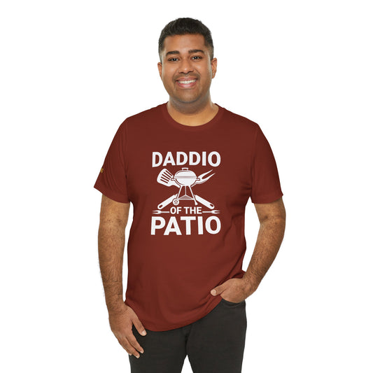 "Daddio of the Patio" BBQ-themed t-shirt with grill, spatula, fork, and crossed grilling tools.