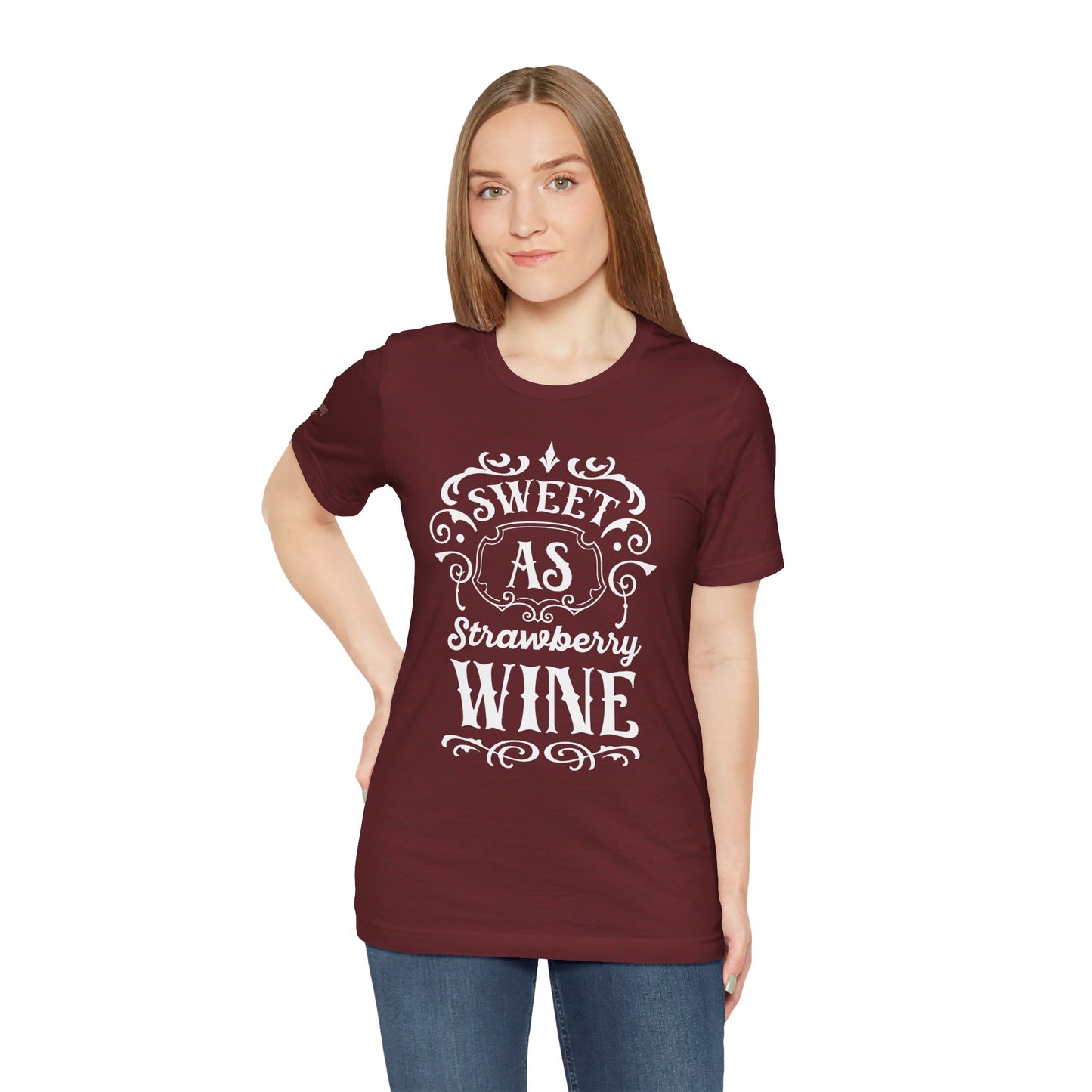 A wine-themed t-shirt design featuring romantic cursive lettering with “Sweet as Strawberry Wine” and subtle vintage-inspired details.