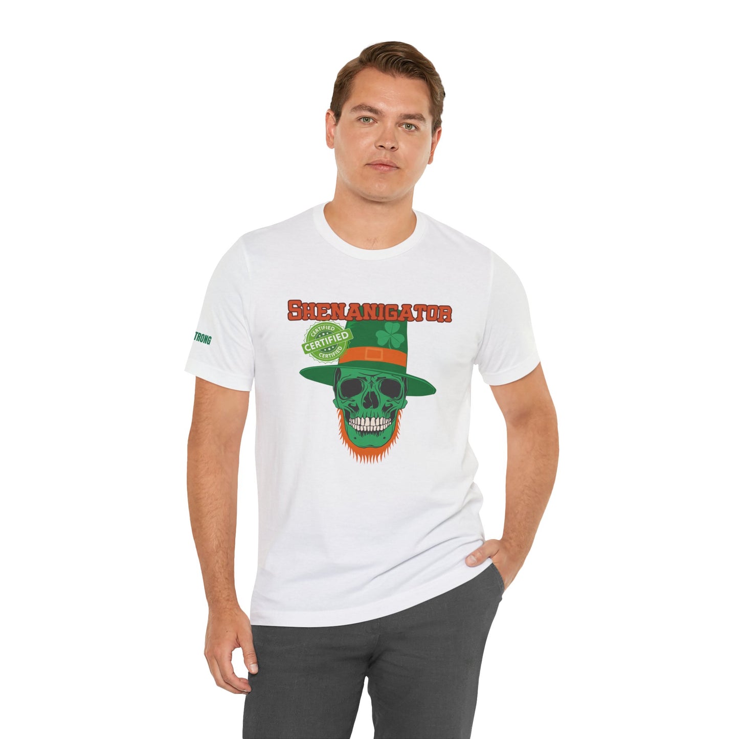 St. Patrick’s Day t-shirt featuring a green skull with an orange beard, wearing a leprechaun hat with a shamrock and a ‘Certified Shenanigator’ stamp, set against a bold Western-style font.