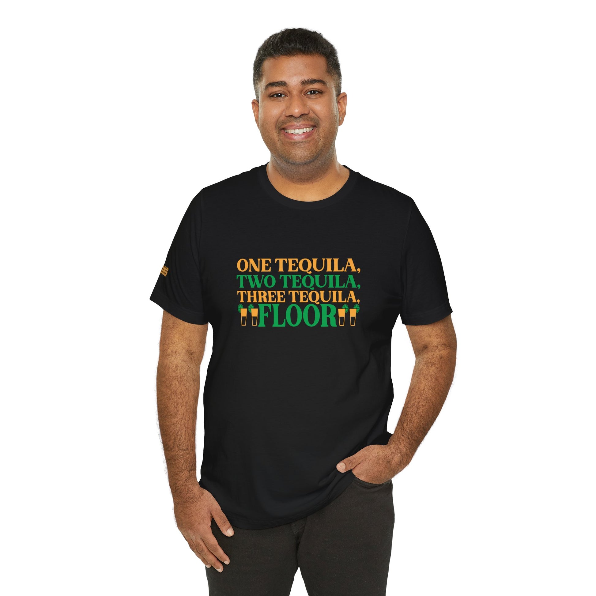 Model wearing the One Tequila, Two Tequila, Three Tequila… Floor t-shirt, available in multiple colors and plus sizes, perfect for tequila drinkers and party-goers.