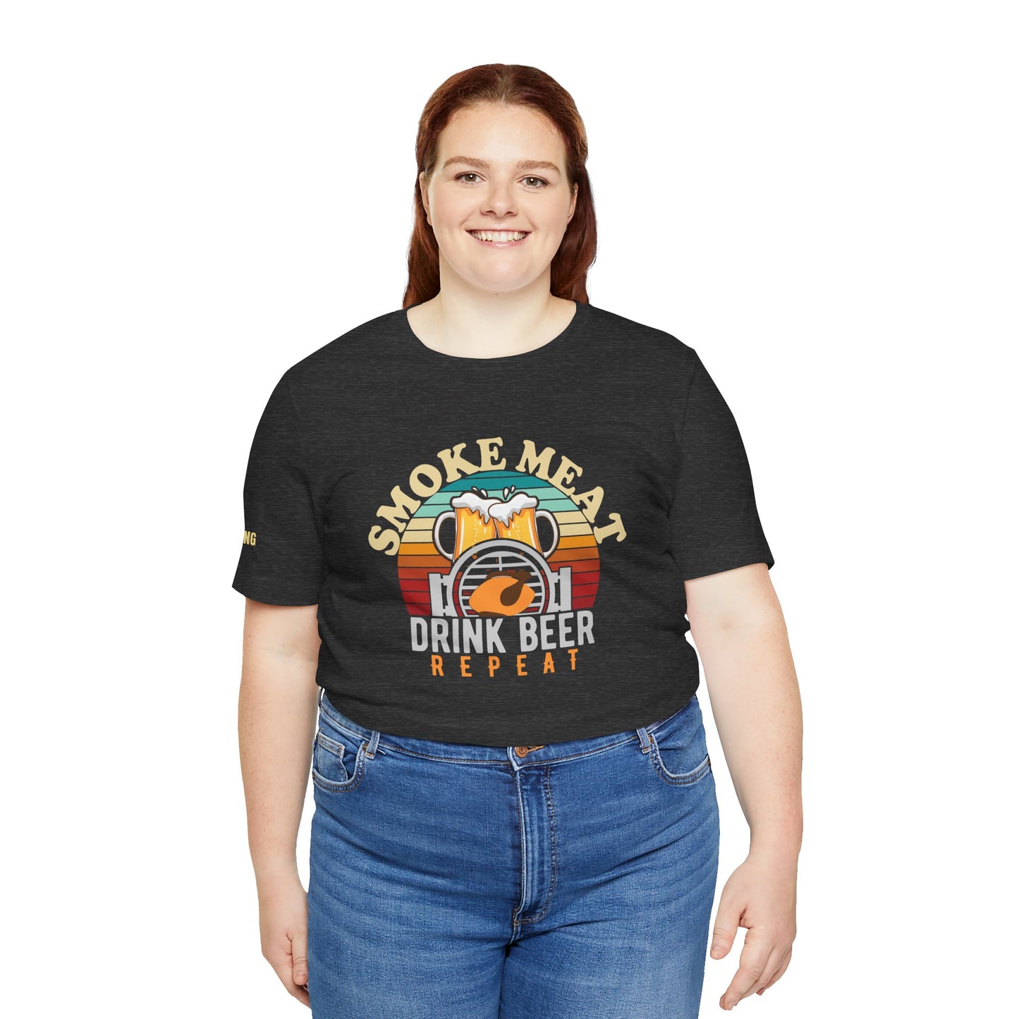 BBQ and beer-themed t-shirt with "Smoke Meat, Drink Beer, Repeat" featuring a grill, beer mugs, and a retro sunset background. Available in plus sizes.
