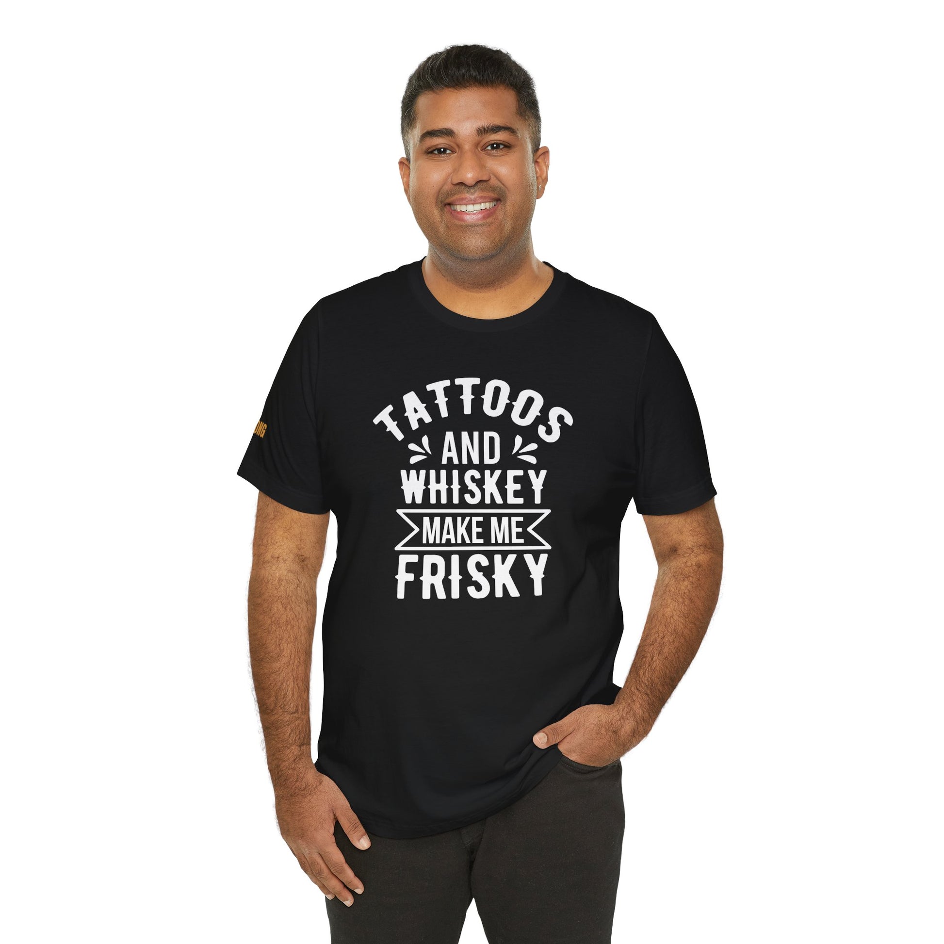 A model wearing the "Tattoos and Whiskey Make Me Frisky" t-shirt, available in multiple colors and plus sizes, ideal for whiskey lovers and tattoo enthusiasts.