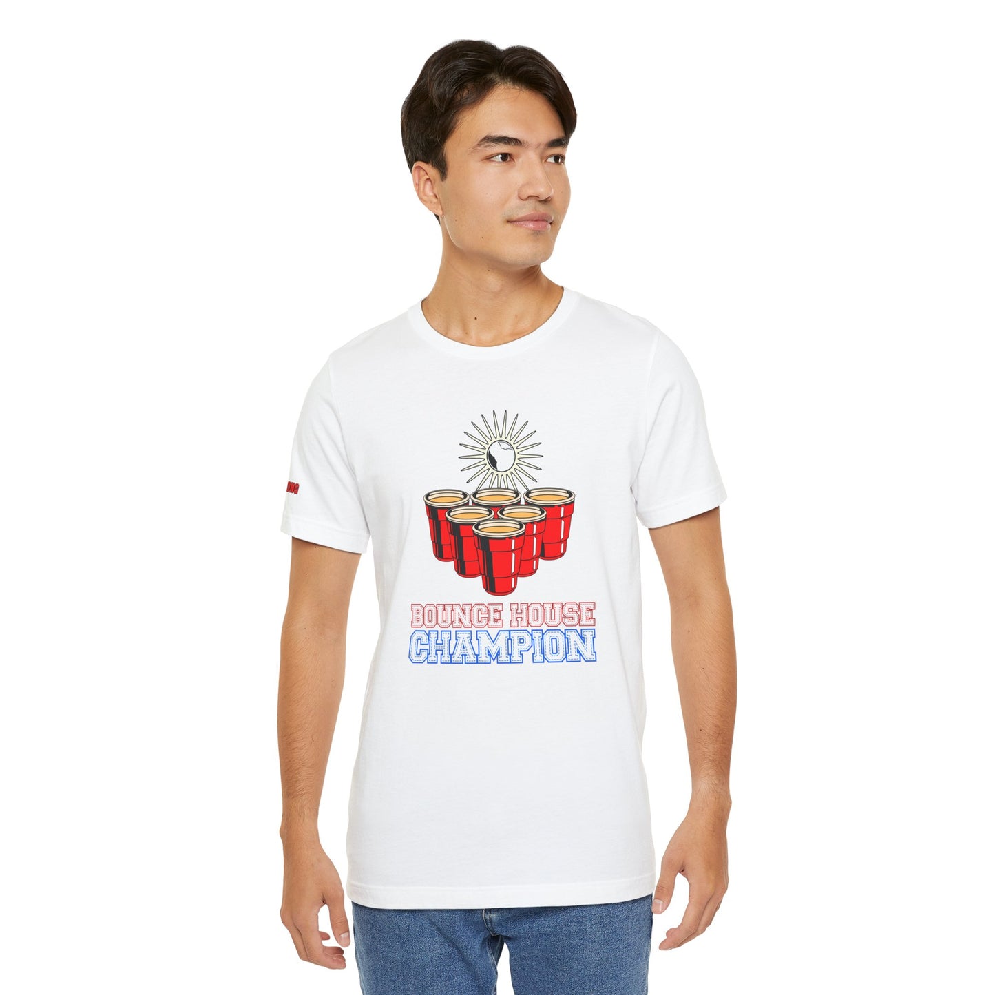 Beer pong-inspired t-shirt with red cups, a glowing ball in mid-bounce, and the bold text “Bounce House Champion.”