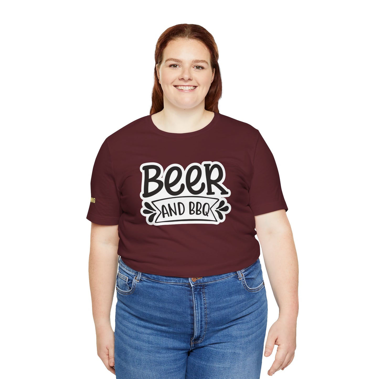 T-shirt with bold text reading "Beer and BBQ" in a vintage-style design, perfect for beer drinkers, grill masters, and BBQ lovers. Available in plus sizes.