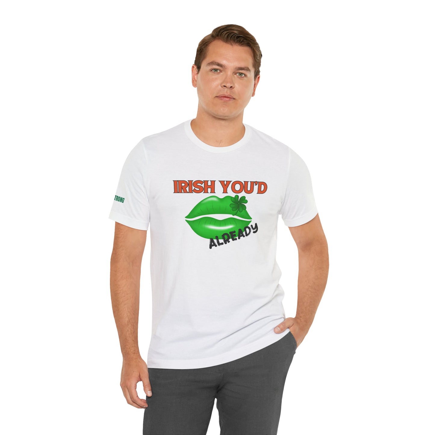 St. Patrick’s Day t-shirt featuring glossy green lips with a shamrock accent and the phrase “Irish You’d Kiss Me Already” in bold orange lettering on a black background.