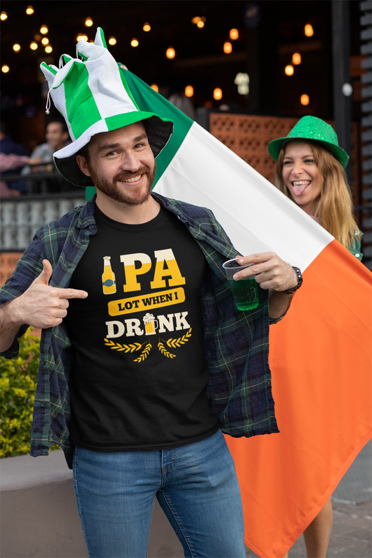 A man wearing Beer Strong t-shirt design featuring the phrase "IPA Lot When I Drink" with beer-themed graphics, including a frothy beer bottle, a beer mug, and golden barley accents. 