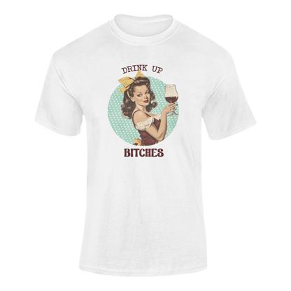A glamorous pin-up girl with dark curls, a yellow bow, and a vintage-style dress holds up a glass of red wine. The background is a polka-dot teal circle, and the text reads "Drink Up Bitches" in bold retro-style font.