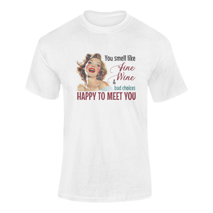 A cheerful, rosy-cheeked pin-up girl with wavy blonde hair smiles brightly. The design features playful retro lettering with the phrase "You smell like fine wine & bad choices – happy to meet you!" in bold, vintage script.