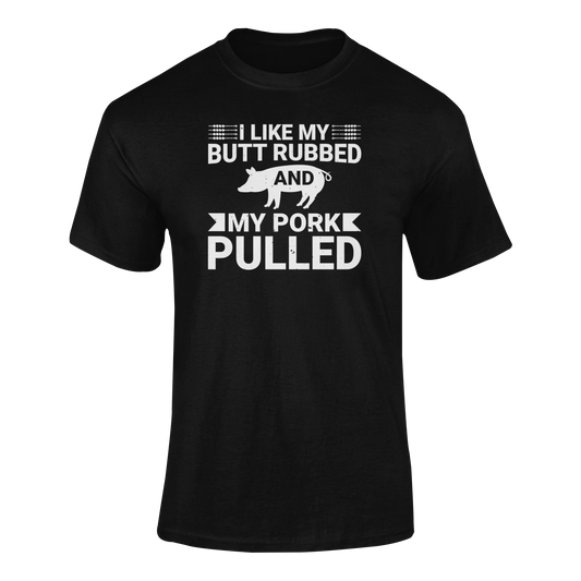BBQ-themed t-shirt design with the phrase "I Like My Butt Rubbed & My Pork Pulled" featuring a pig silhouette and grilling utensils.