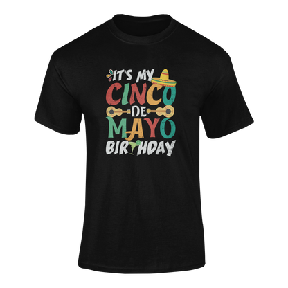 Funny Cinco de Mayo birthday t-shirt featuring a sombrero, guitars, and festive lettering. Ghosted mockup.
