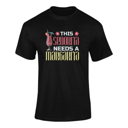 Cinco de Mayo t-shirt featuring the phrase "This Señorita Needs a Margarita" with a colorful cocktail illustration. Ghosted mockup.