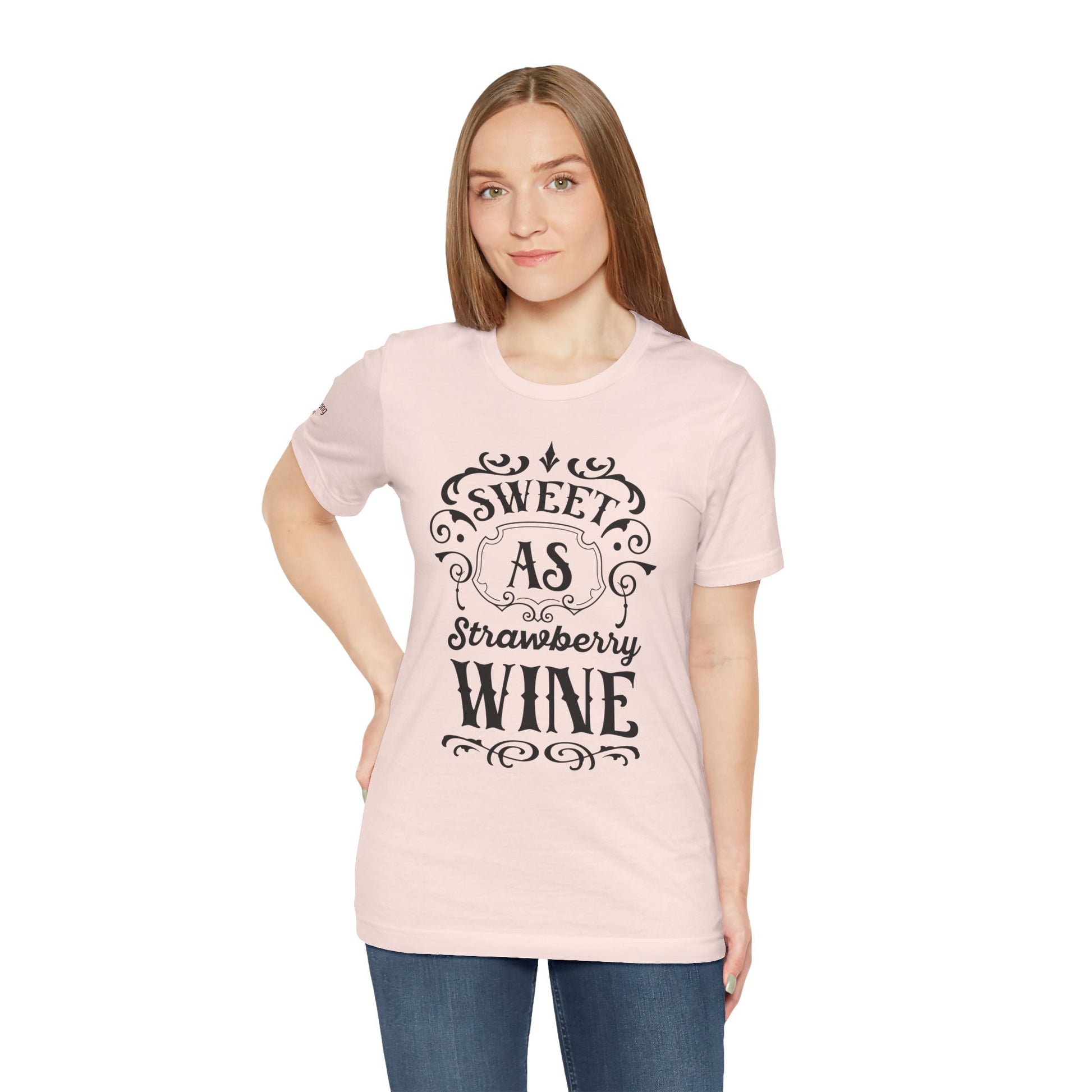 A wine-themed t-shirt design featuring romantic cursive lettering with “Sweet as Strawberry Wine” and subtle vintage-inspired details.