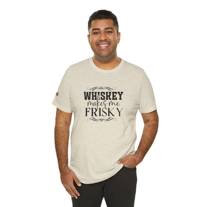 Design featuring the phrase Whiskey Makes Me Frisky, ideal for whiskey lovers who enjoy a little fun with their drink. Shown in shade of beige, available in many colors and plus sizes.