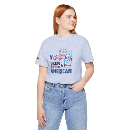 Funny 4th of July beer t-shirt featuring a red, white, and blue exploding beer can, fireworks, and bold patriotic text saying "Beer & Cheer American." Perfect for Independence Day, beer lovers, and patriotic celebrations. in Heather Soft Blue.