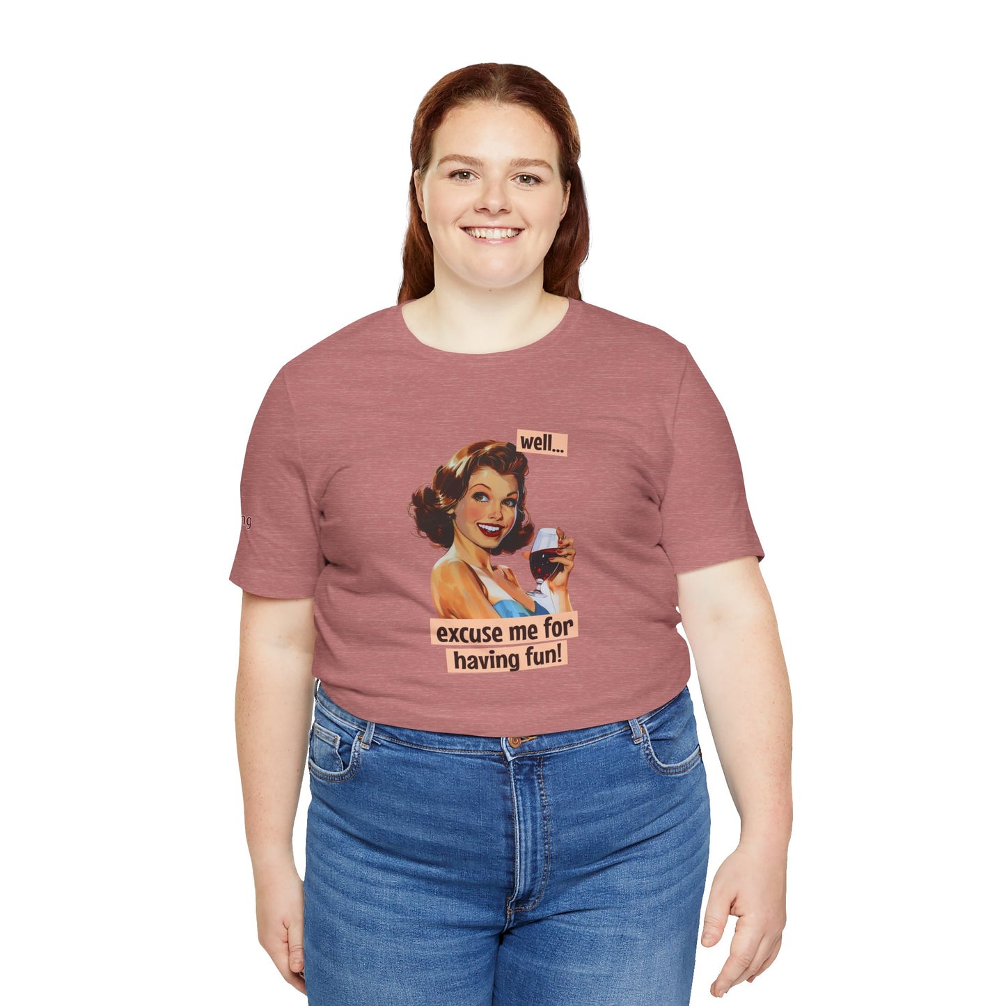 Retro pin-up girl in a blue dress holding a glass of red wine, smiling confidently, with the phrase "Well… excuse me for having fun!" in a playful vintage-style banner, in plus sizes.