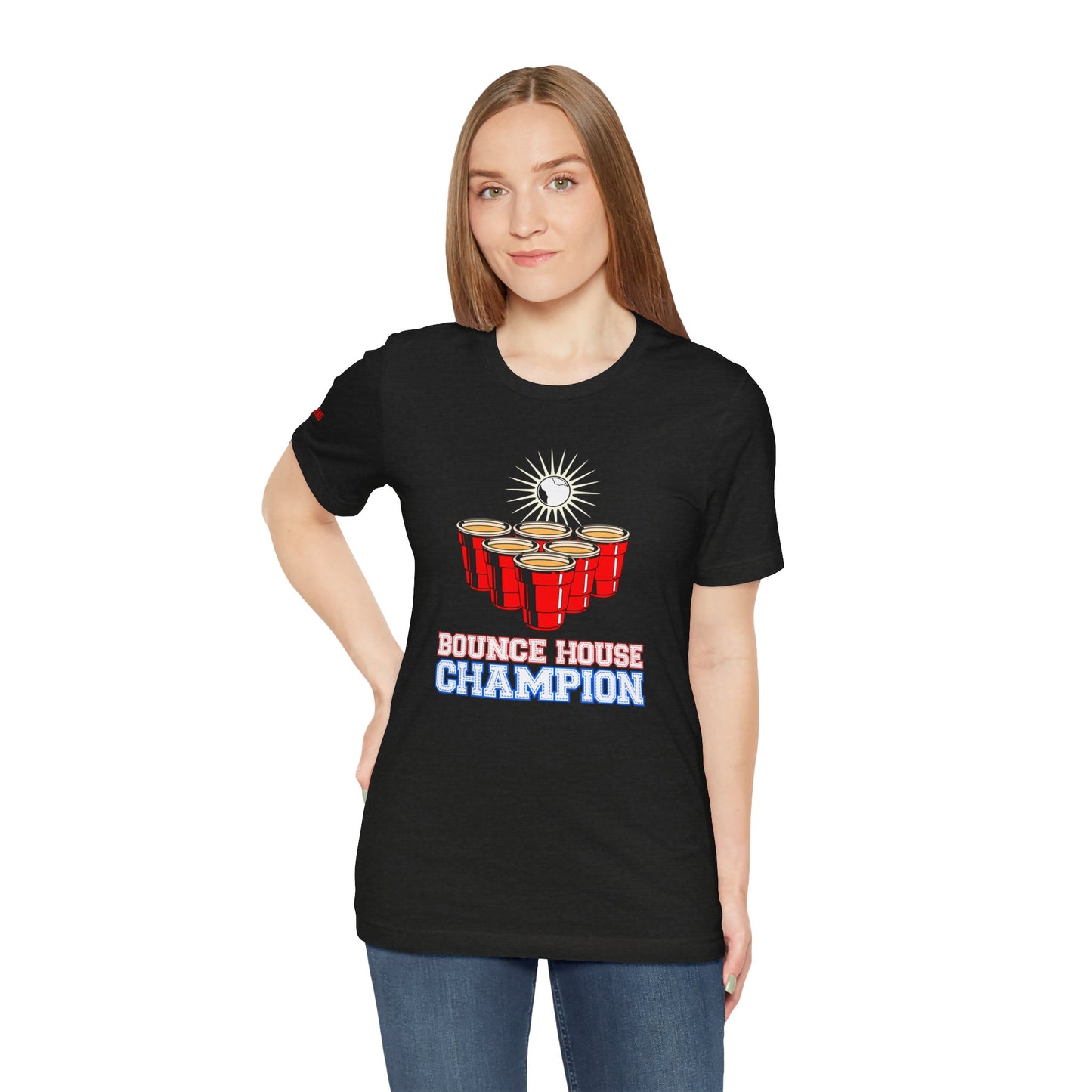 Beer pong-inspired t-shirt with red cups, a glowing ball in mid-bounce, and the bold text “Bounce House Champion.”