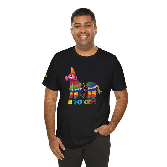 Model wearing a funny Cinco de Mayo t-shirt with a broken piñata design, available in multiple colors and plus sizes.