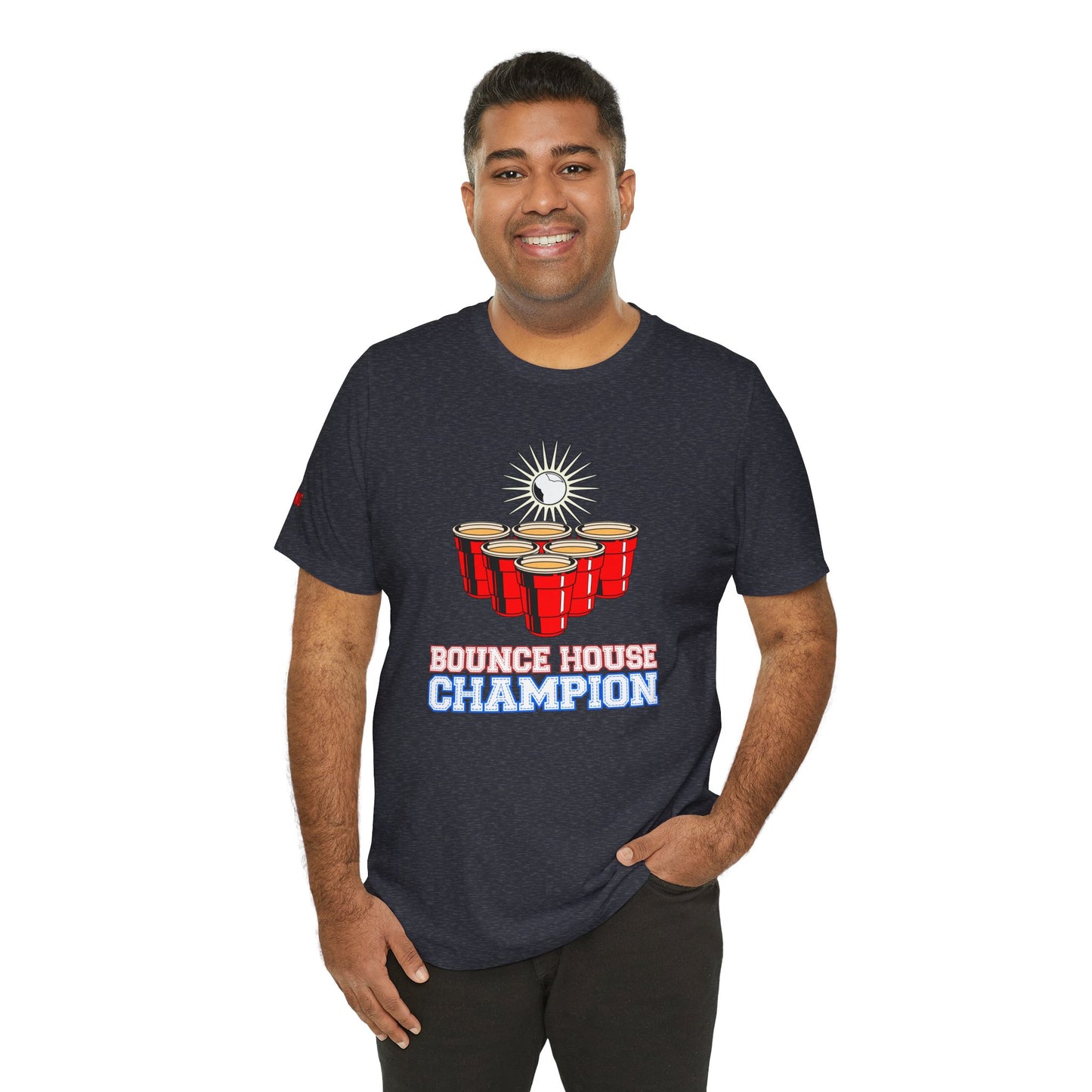 Beer pong-inspired t-shirt with red cups, a glowing ball in mid-bounce, and the bold text “Bounce House Champion.”