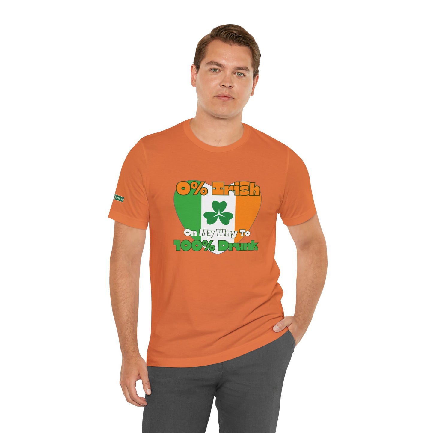 Funny St. Patrick’s Day drinking t-shirt featuring a heart-shaped Irish flag with a shamrock and the phrase “0% Irish, On My Way to 100% Drunk” in bold, playful text.