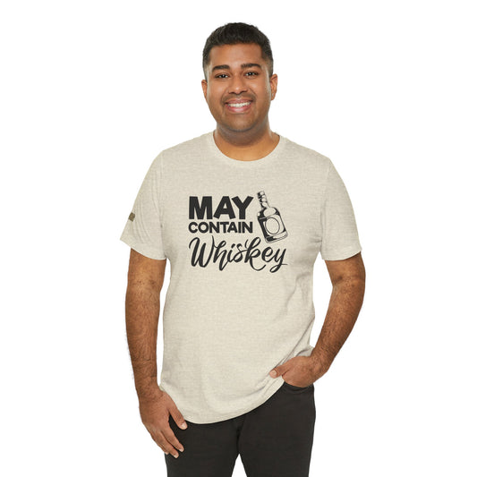 Whiskey-themed design featuring the phrase May Contain Whiskey with a bottle and playful lettering.  Shown in shade of beige; available in many colors and plus sizes.