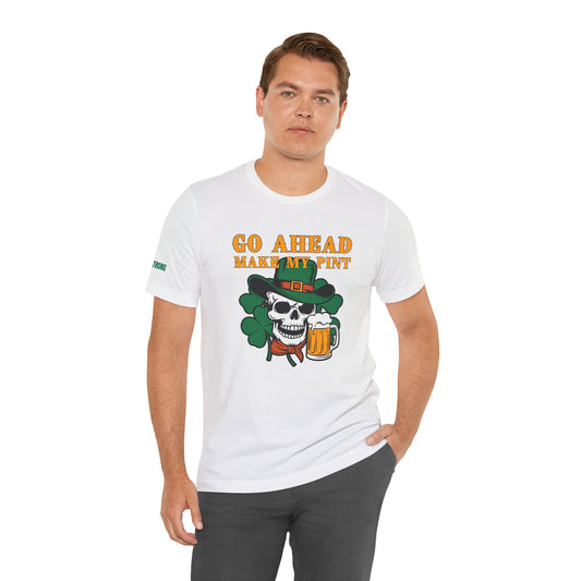 St. Patrick’s Day t-shirt featuring a skull in a green leprechaun hat, holding a mug of beer, with a shamrock backdrop and the bold phrase "Go Ahead, Make My Pint" in Western-style lettering.