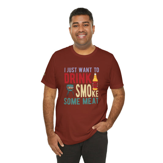 T-shirt design with "I Just Want to Drink Beer & Smoke Some Meat" text, featuring a grill, beer bottle, and bold typography for BBQ and beer lovers.