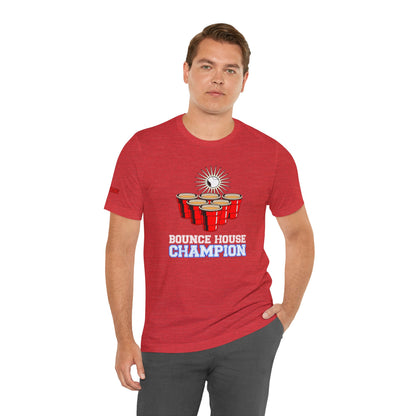 Beer pong-inspired t-shirt with red cups, a glowing ball in mid-bounce, and the bold text “Bounce House Champion.”